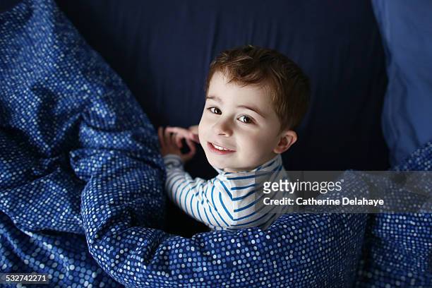 a 3 years old boy in his bed - 2 3 years stock pictures, royalty-free photos & images