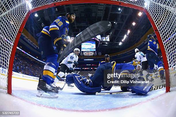 Brian Elliott of the St. Louis Blues tends goal in Game Two of the Western Conference Final as Kyle Brodziak looks on against the San Jose Sharks...