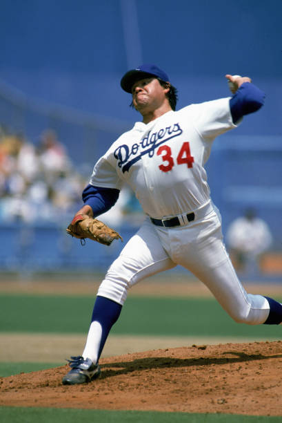 Pitcher Fernando Valenzuela of the Los Angeles Dodgers delivers a pitch during a July 1988 game at Dodger Stadium in Los Angeles, California.