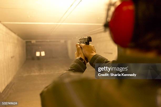 man in target practice - tiro a segno foto e immagini stock