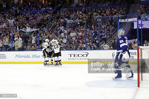 Phil Kessel of the Pittsburgh Penguins celebrates with his teammates after scoring a goal against Andrei Vasilevskiy of the Tampa Bay Lightning...