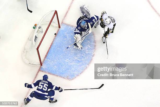 Carl Hagelin of the Pittsburgh Penguins scores a goal during the second period against Andrei Vasilevskiy of the Tampa Bay Lightning in Game Three of...