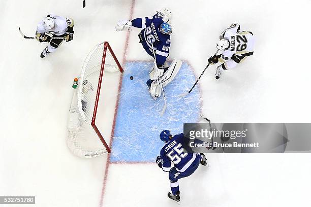 Carl Hagelin of the Pittsburgh Penguins scores a goal during the second period against Andrei Vasilevskiy of the Tampa Bay Lightning in Game Three of...