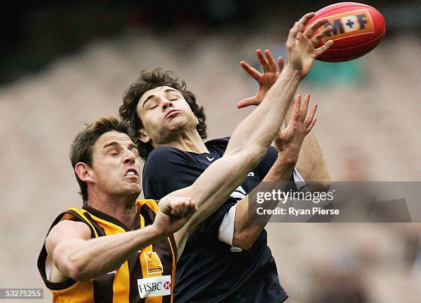 Danny Jacobs for the Hawks spoils Troy Longmuir for the Blues during the round seventeen AFL match between the Hawthorn Hawks and the Carlton Blues...