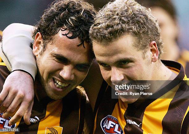 Mark Williams and Rick Ladson for the Hawks celebrate after the round seventeen AFL match between the Hawthorn Hawks and the Carlton Blues at the...