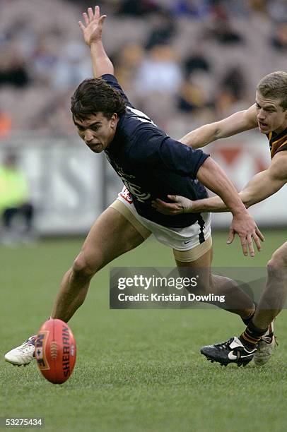 Andrew Carrazzo for the Blues in action during the round seventeen AFL match between the Hawthorn Hawks and Carlton Blues at the MCG on July 23, 2005...