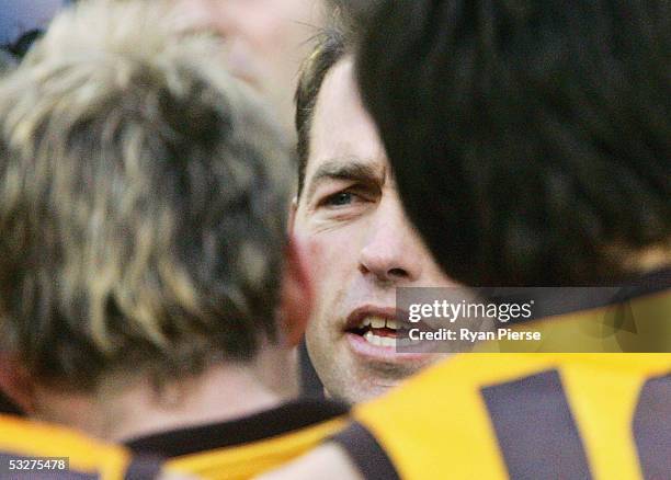 Alastair Clarkson, coach of the Hawks addresses his team during the round seventeen AFL match between the Hawthorn Hawks and the Carlton Blues at the...