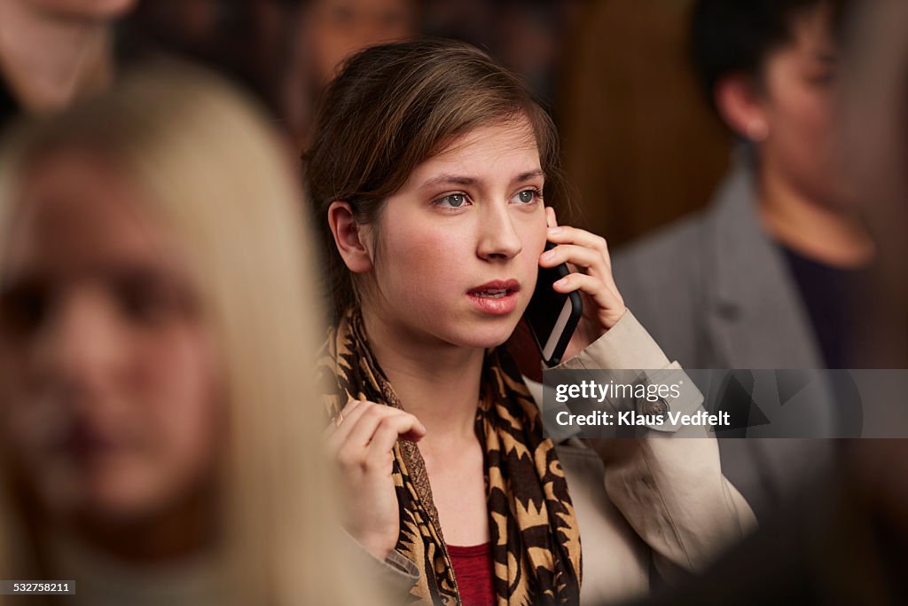 Young woman recieving chocking message on phone