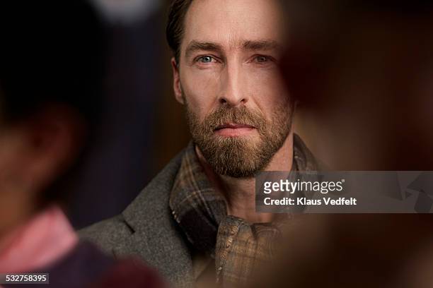 portrait of man standing in crowd - beard men street foto e immagini stock