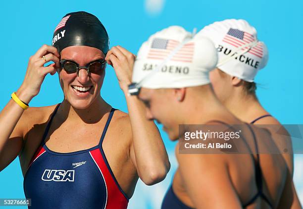 Kristen Caverly, Kaitlin Sandeno and Caroline Burckle of the United States share a laugh before getting in the water for a training session before...