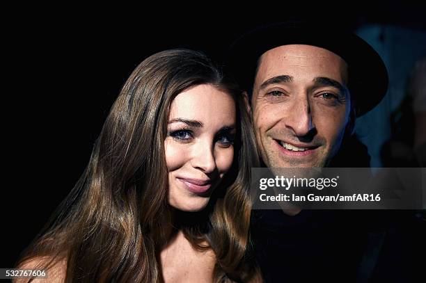 Lara Leito and Adrien Brody pose backstage at the amfAR's 23rd Cinema Against AIDS Gala at Hotel du Cap-Eden-Roc on May 19, 2016 in Cap d'Antibes,...