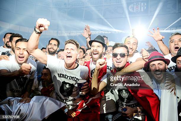 Mario Gomez of Besiktas celebrates w.th the team mates during the Besiktas' Turkish Super Lig title trophy ceremony at the Vodafone Arena in...