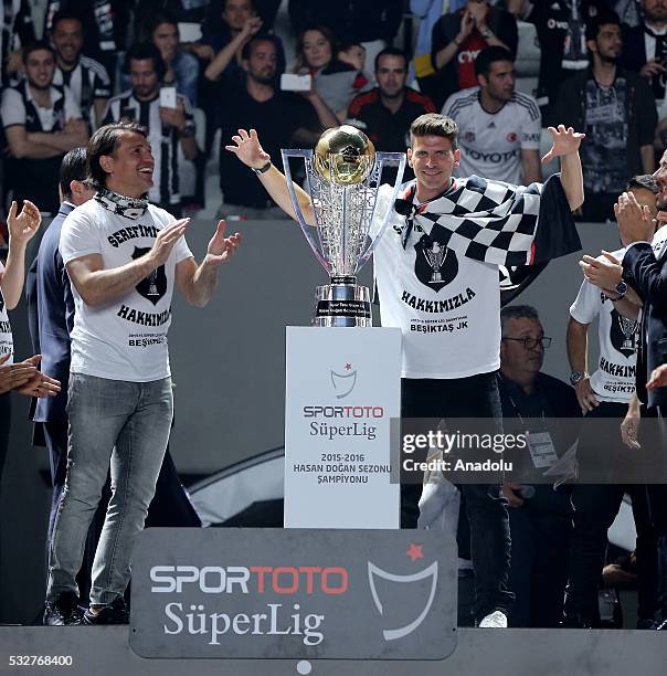 Mario Gomez of Besiktas poses next to the trophy during the Besiktas' Turkish Super Lig title trophy ceremony at the Vodafone Arena in Istanbul,...