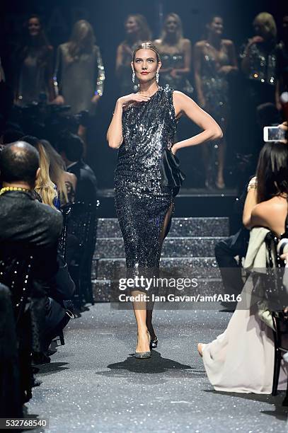 Karlie Kloss walks the runway at the amfAR's 23rd Cinema Against AIDS Gala at Hotel du Cap-Eden-Roc on May 19, 2016 in Cap d'Antibes, France.