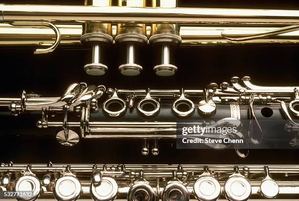 trumpet, clarinet, and flute - blechblasinstrument stock-fotos und bilder