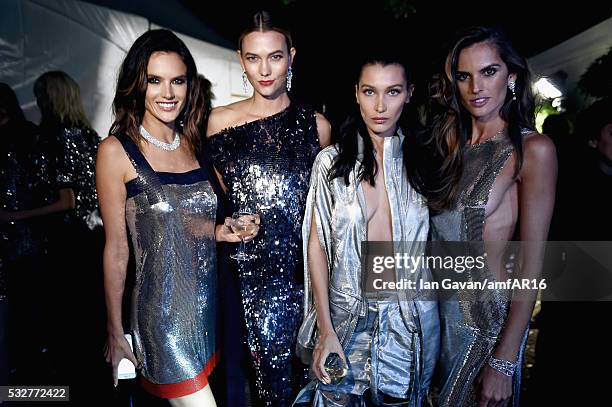 Alessandra Ambrosio, Karlie Kloss, Bella Hadid and Izabel Goulart prepare backstage at the amfAR's 23rd Cinema Against AIDS Gala at Hotel du...