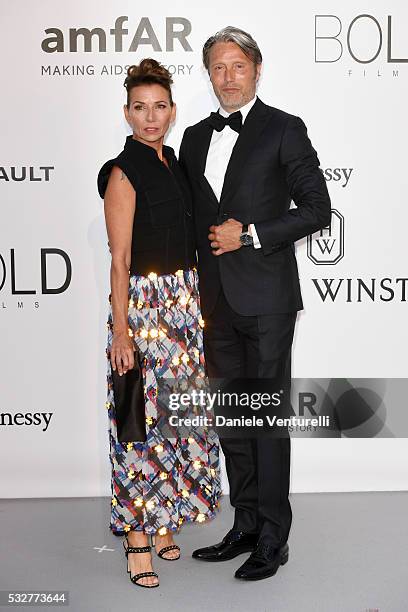 Actor Mads Mikkelsen and wife Hanne Jacobsen attend the amfAR's 23rd Cinema Against AIDS Gala at Hotel du Cap-Eden-Roc on May 19, 2016 in Cap...