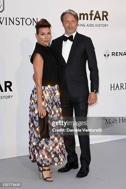 Actor Mads Mikkelsen and wife Hanne Jacobsen attend the amfAR's 23rd Cinema Against AIDS Gala at Hotel du Cap-Eden-Roc on May 19, 2016 in Cap...