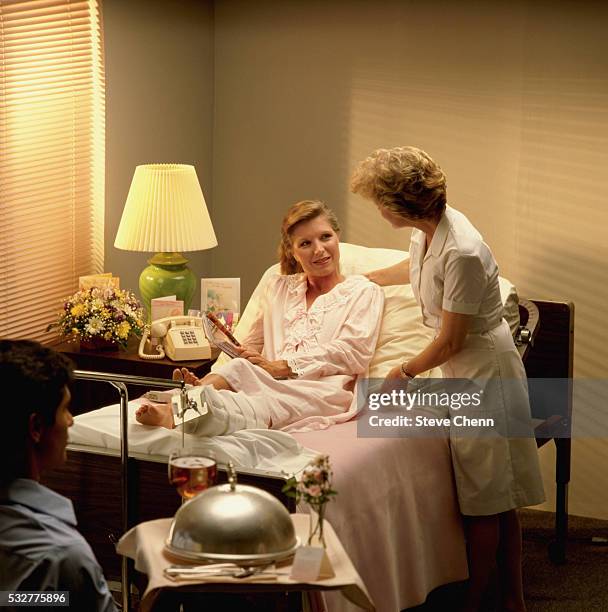 nurse with patient in hospital - archival hospital stock pictures, royalty-free photos & images