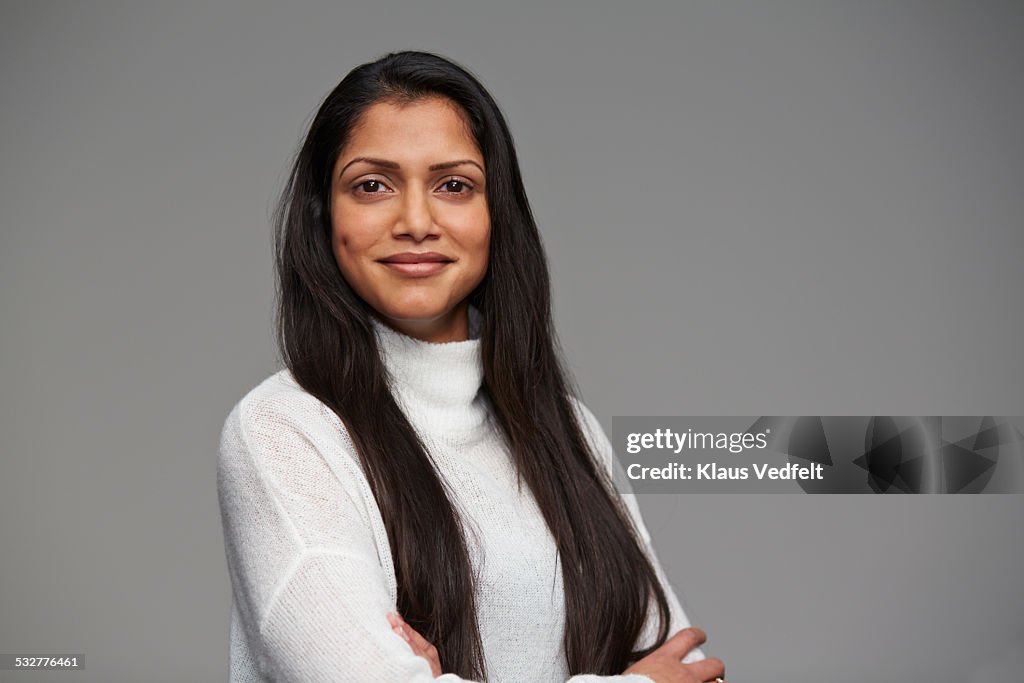 Portrait of cool woman with crossed arms