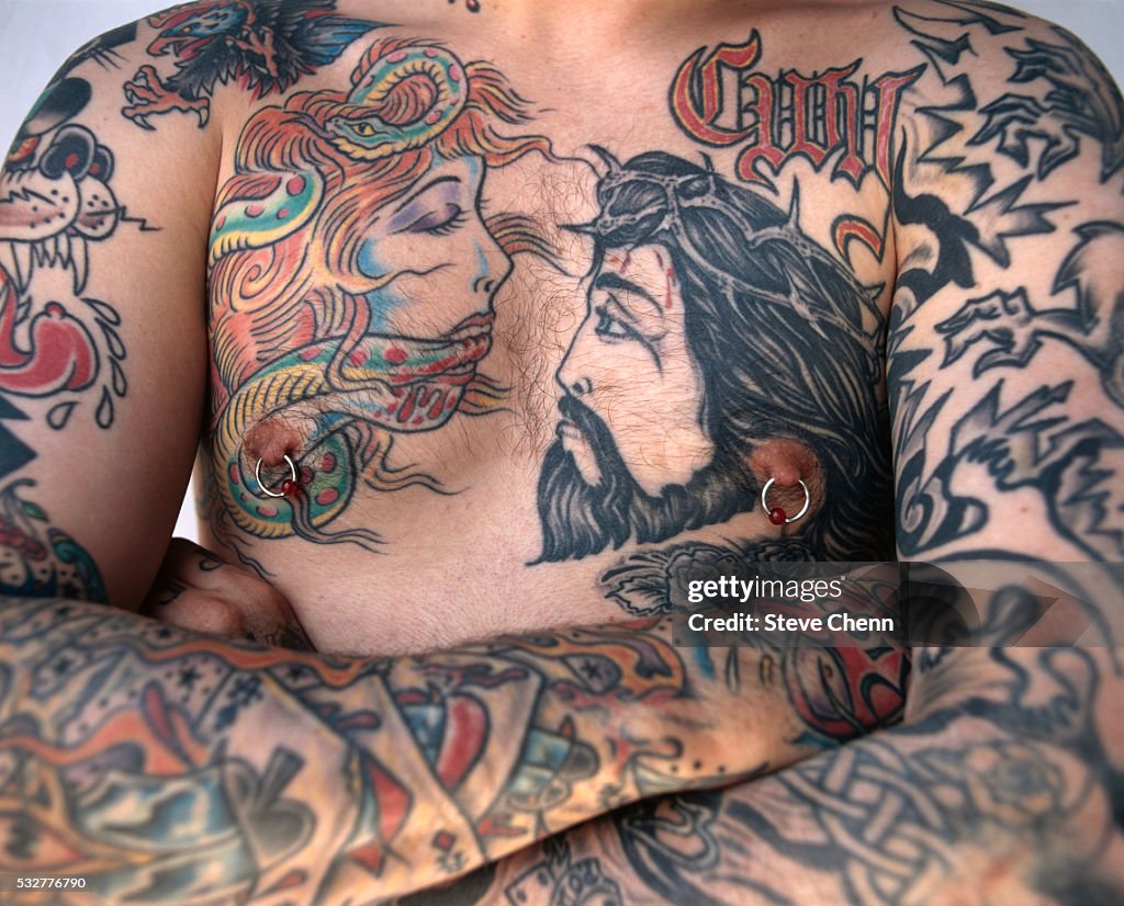 Man with Eve and Jesus Tattooed on His Chest