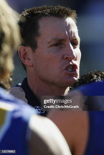 Eagles coach John Worsfold talks to his players during the round seventeen AFL match between the Sydney Swans and the West Coast Eagles held at the...