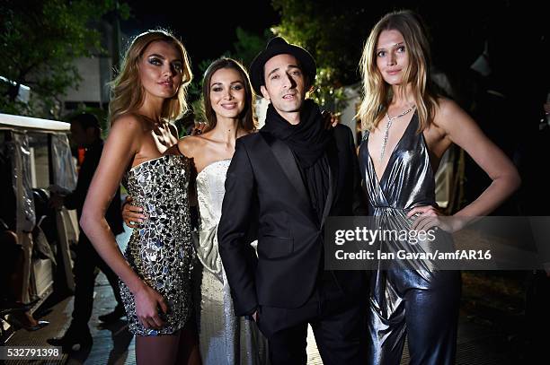 Alina Baikova, Lara Leito, Adrian Brody and Toni Garrn pose backstage at the amfAR's 23rd Cinema Against AIDS Gala at Hotel du Cap-Eden-Roc on May...