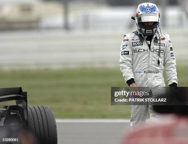 McLaren-Mercedes Finnish driver Kimi Raikkonen leaves the Hockenheim racetrack after he retired of the German Grand Prix because of mechanical...