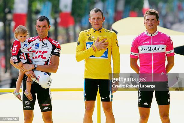 Ivan Basso of Italy from CSC Team , Lance Armstrong of the USA riding for the Discovery Channel and Jan Ullrich of Germany from The T-Mobile Team on...