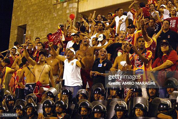 Fans cheers during the African Champions League Group B match between Egypt's Zamalek club and Tunisian Esperance club, 24 July 2005 in Cairo. AFP...