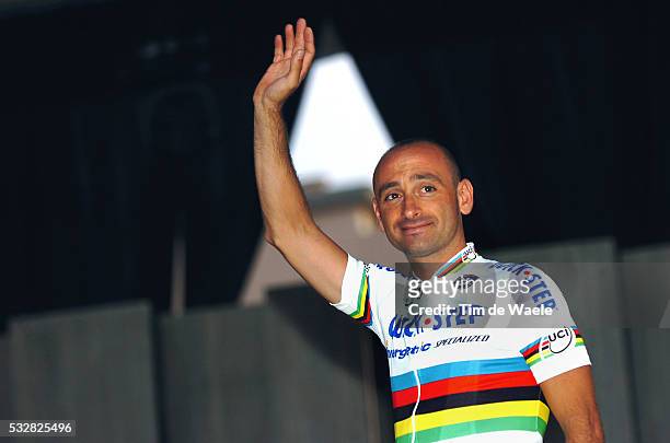 World Champion Paolo Bettini waves during the presentation ceremony of the 2008 Tour of Italy.