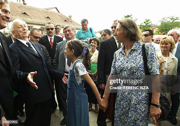 Hungarian President Ferenc Madl chats with members of Romania's Hungarian minority in the Romanian town of Zilau 18 June 2005. Madl is on a two-day...