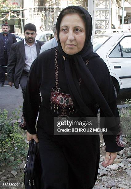 Iranian lawyer and Nobel peace laureate Shirin Ebadi and her colleague Mohammad Seifzadeh arrive at court to attend the appeal over the murder of...