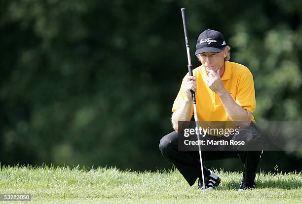 Bernhard Langer of Germany checks the line for a put during the final days play of The Deutsche Bank Players Championships at Gut Kaden Golf Club on...