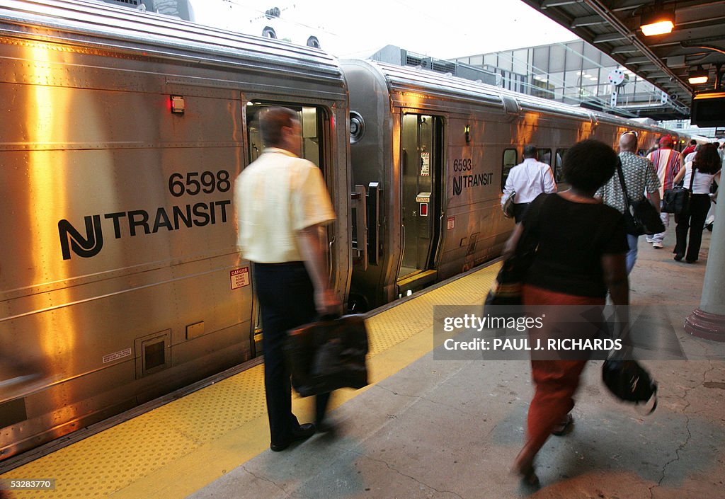 Passengers get off trains on the first d