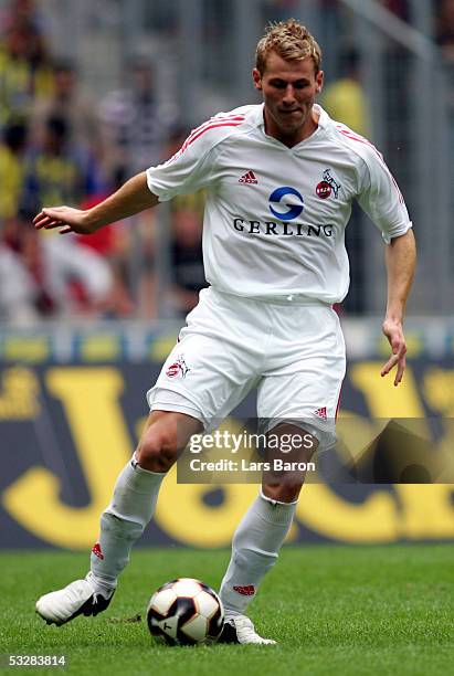 Lukas Sinkiewicz of Cologne runs with the ball during the friendly match between 1.FC Cologne and Fenerbahce Istanbul at the Rhein Energie Stadium on...