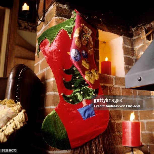 traditional english christmas interior decoration - big xmas stocking stock pictures, royalty-free photos & images