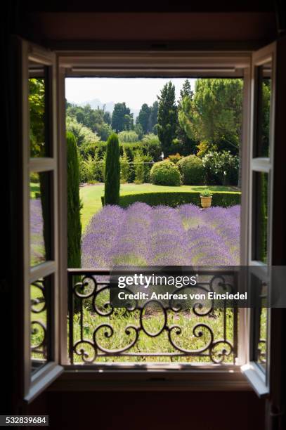 french holiday home in provence - window with view on garden stockfoto's en -beelden