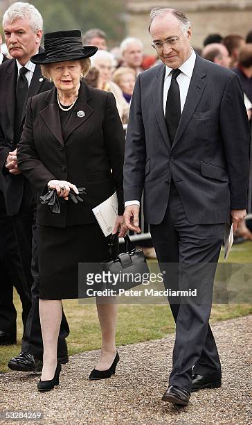 Former Prime Minister Lady Thatcher and Conservative Party leader Michael Howard are seen leaving Salisbury Cathedral after attending the funeral of...