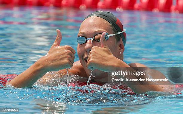 Flavia Rigamonti of Switzerland gives the thumbs up after finishing the 1500 meter Freestyle preliminary heats at the XI FINA World Championships at...