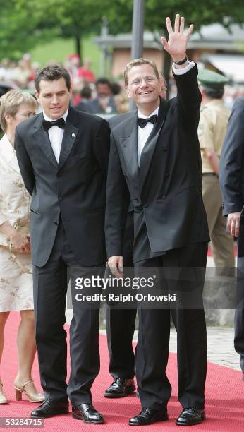 Leader of Germany's Free Democrats Guido Westerwelle and his partner Michael Mronz arrive for the opening performance of Richard Wagner's "Tristan...