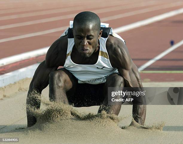 Helsinki , FINLAND: US Dwight Phillips performs in men's long jump at the Helsinki GP event in the Helsinki Olympic Stadium 25 July 2005. Phillips...