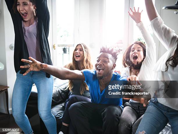 group of college student happiness on the sofa - celebrate living stockfoto's en -beelden