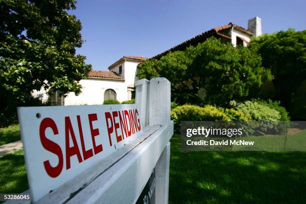 House is seen with a "For Sale" sign on it on July 25, 2005 in Pasadena, California. Existing home prices are shooting up at the fastest pace in...