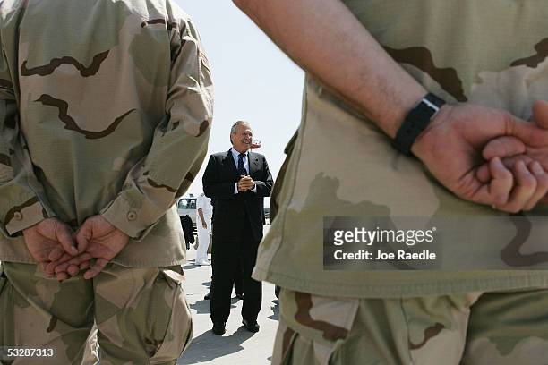 Secretary of Defense Donald Rumsfeld meets with U.S. Air force personnel as he prepares to depart July 26, 2005 from Manas Airport in Bishkek,...