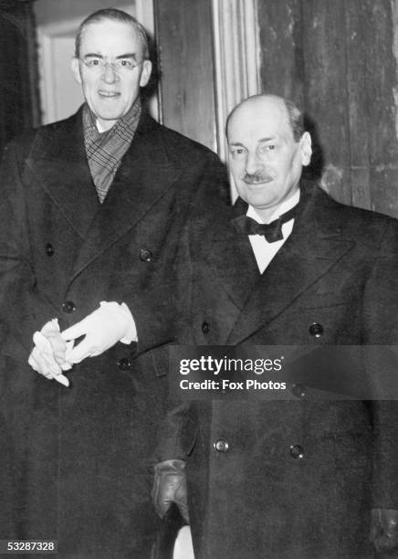 Sir Stafford Cripps , President of the Board of Trade and British Prime Minister Clement Attlee arrive at St James' Palace for a state banquet held...