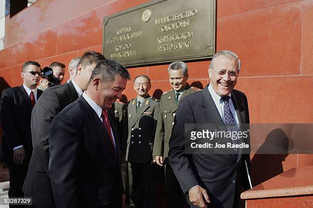 Secretary of Defense Donald Rumsfeld walks with Kyrgyzstan Minister of Defense General Major Ismail Isakov as he arrives for a meeting July 26, 2005...
