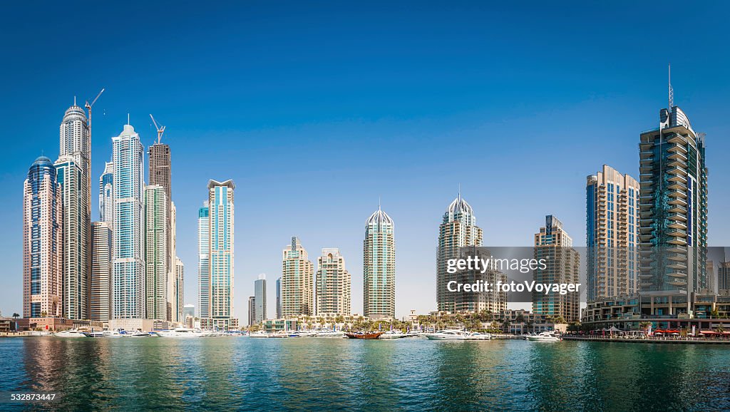 Luxury highrise apartments soaring into blue sky above Dubai Marina