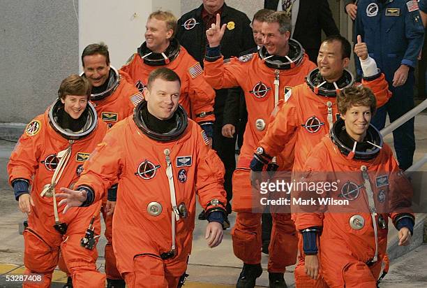 Space Shuttle Discovery astronauts Wendy Lawrence, Charles Camarda, Andrew Thomas, pilot Jim Kelly, Stephen Robinson, Siochi Noguchi, of JAXA, and...