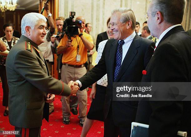 Tajikistan Minister of Defense Colonel General Sherali Khairulloyev shakes hands with U.S. Secretary of Defense Donald Rumsfeld as he arrives for a...